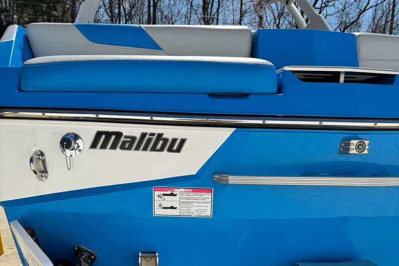 Slide: The Image of 2019 Malibu Wakesetter 23 LSV boat, blue and white exterior, close-up view. - 19