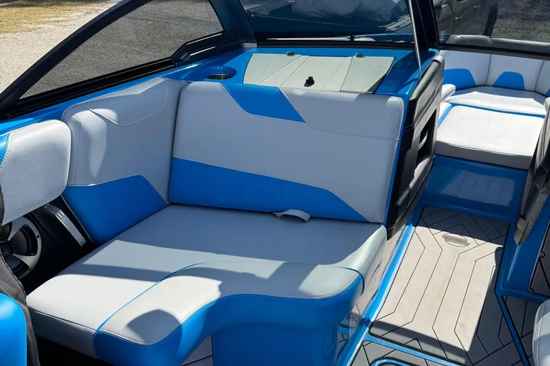 Slide: The Image of 2019 Malibu Wakesetter 23 LSV interior with blue and white seating. - 23