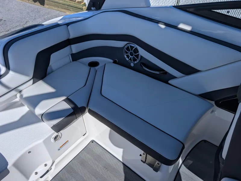 Slide: The Image of 2019 Yamaha Boats 242 Limited S interior seating with speaker and cup holder. - 15