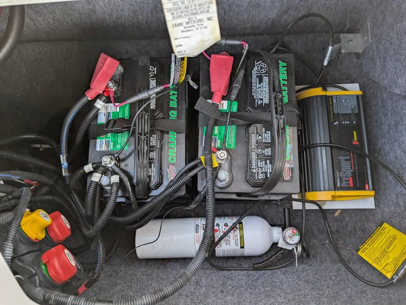 Slide: The Image of Batteries and fire extinguisher in 2019 Yamaha Boats 242 Limited S compartment. - 21