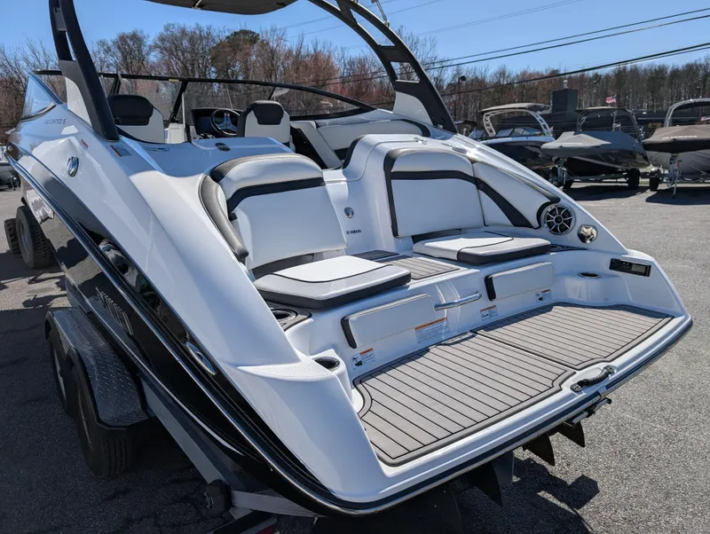 Slide: The Image of 2019 Yamaha Boats 242 Limited S with sleek design and spacious seating. - 9