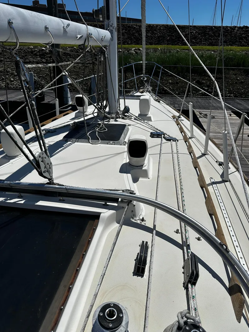 Slide: The Image of 1985 Sabre 32 Aft Cabin sailboat deck with rigging and mast in marina. - 5