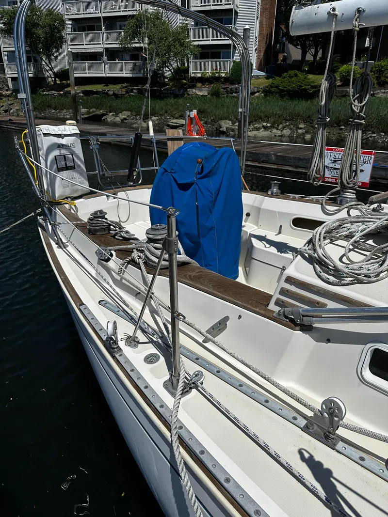Slide: The Image of 1985 Sabre 32 Aft Cabin sailboat docked, featuring deck and rigging details. - 6