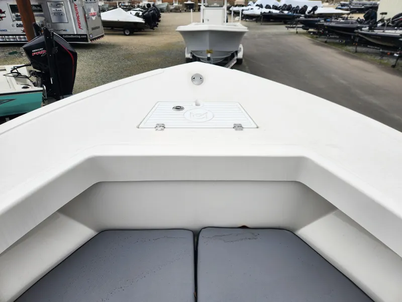 Slide: The Image of 2025 May-Craft 245 Offshore CC boat bow with seating and storage compartment. - 10