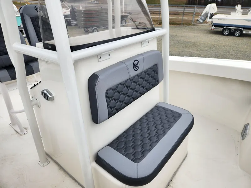 Slide: The Image of 2025 May-Craft 245 Offshore CC boat seat with gray and black cushioned design. - 11