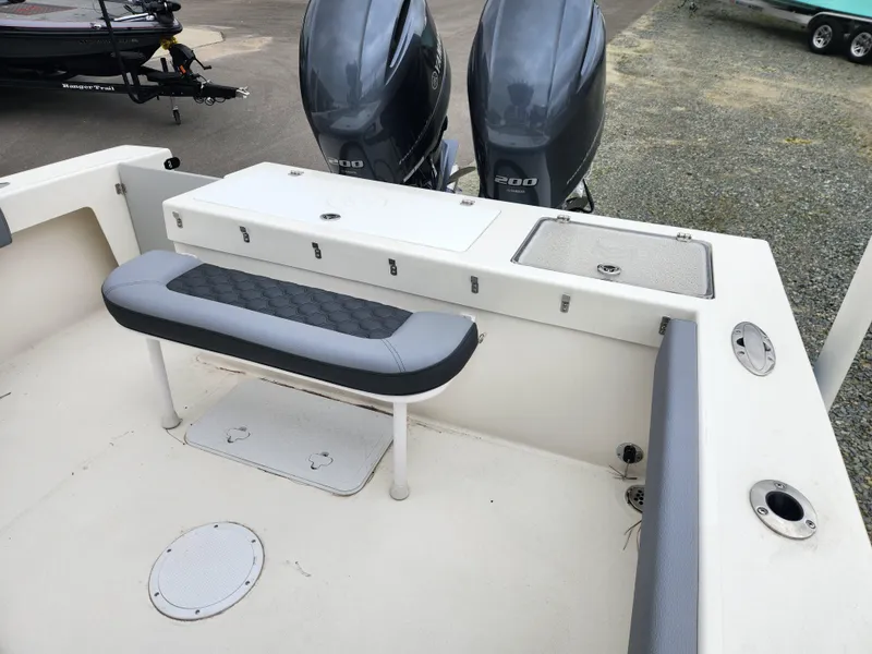 Slide: The Image of 2025 May-Craft 245 Offshore CC boat with dual engines and seating area. - 16