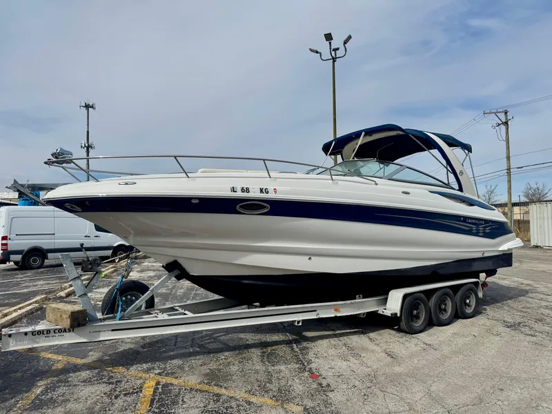 Slide: The Image of 2008 Crownline 315 SCR boat on trailer in parking lot. - 0