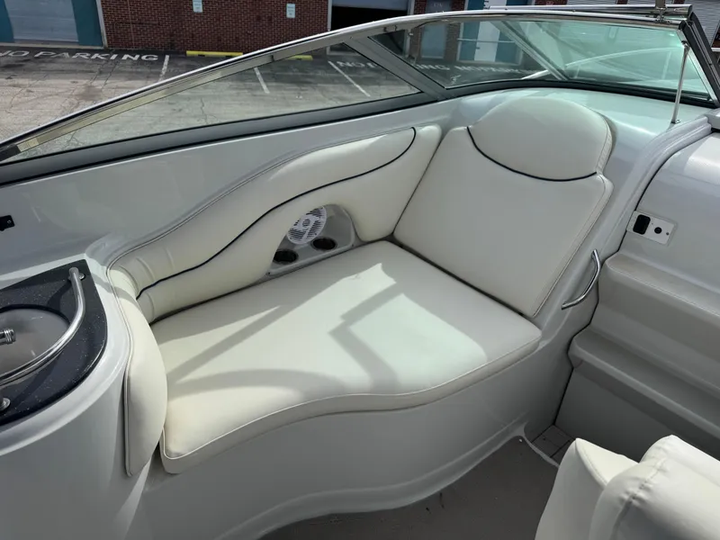 Slide: The Image of 2008 Crownline 315 SCR boat interior with white seating and sleek design. - 13