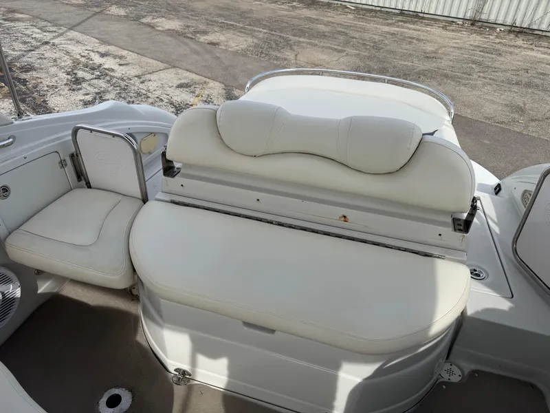 Slide: The Image of 2008 Crownline 315 SCR boat interior with white leather seating and storage compartments. - 14