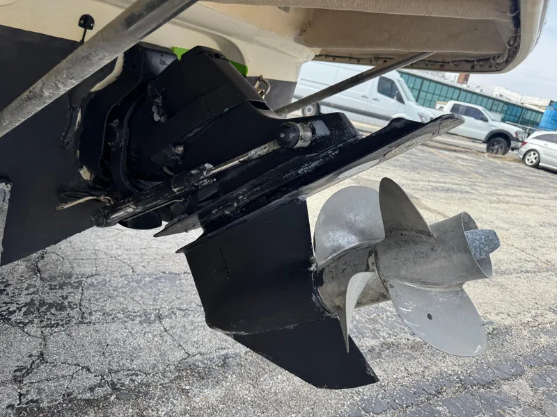 Slide: The Image of 2008 Crownline 315 SCR boat propeller and stern drive on pavement. - 27