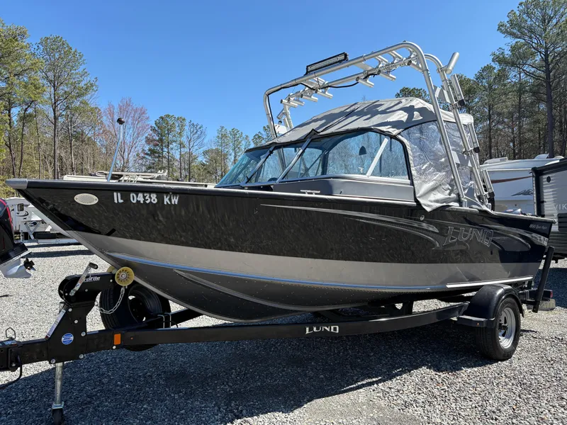 Slide: The Image of 2017 Lund 1800 Sport Angler boat on trailer, parked outdoors. - 1