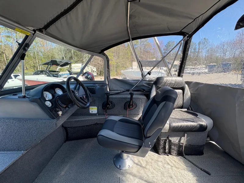 Slide: The Image of 2017 Lund 1800 Sport Angler interior with steering wheel and seating. - 16