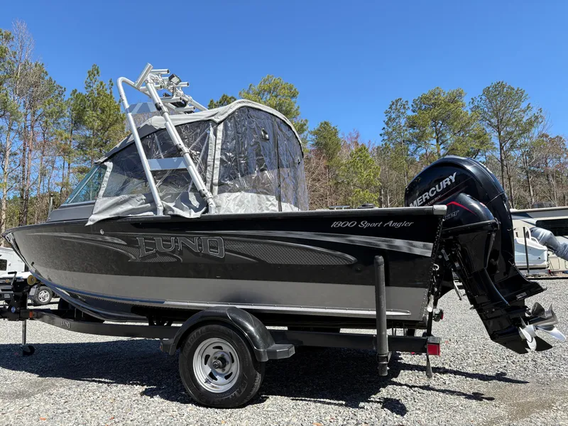 Slide: The Image of 2017 Lund 1800 Sport Angler boat with Mercury engine on a trailer. - 2
