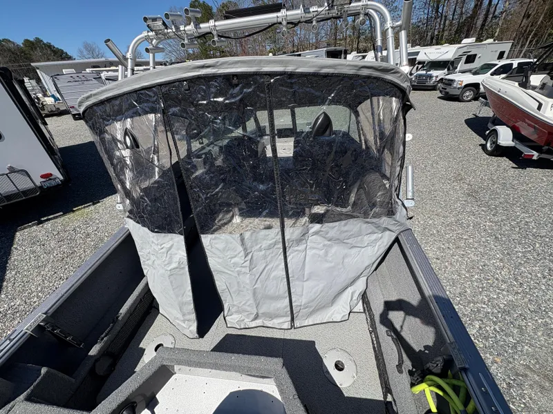 Slide: The Image of 2017 Lund 1800 Sport Angler boat with protective cover in a parking lot. - 9