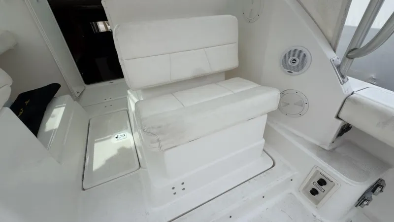Slide: The Image of 2005 Tiara Yachts 2900 Open interior with white seating and speaker system. - 13