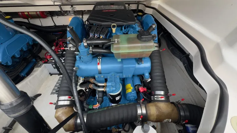 Slide: The Image of Engine compartment of a 2005 Tiara Yachts 2900 Open, showcasing a well-maintained marine engine. - 47