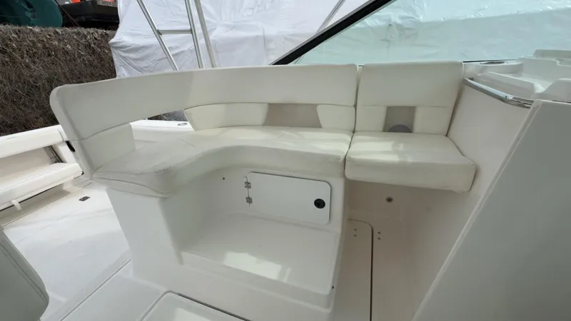 Slide: The Image of 2005 Tiara Yachts 2900 Open interior seating with white upholstery. - 15