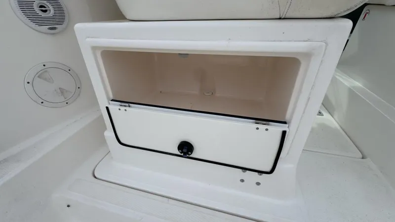 Slide: The Image of 2005 Tiara Yachts 2900 Open storage compartment with speaker detail. - 14