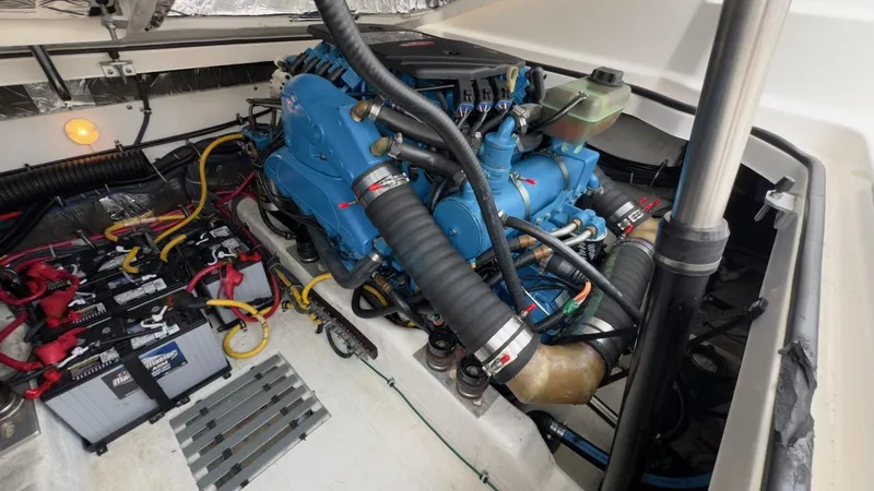 Slide: The Image of Engine compartment of a 2005 Tiara Yachts 2900 Open, featuring a blue marine engine. - 45