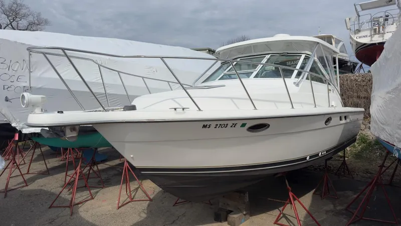 The Image of 2005 Tiara Yachts 2900 Open boat on stands, white hull, outdoor storage. - 1