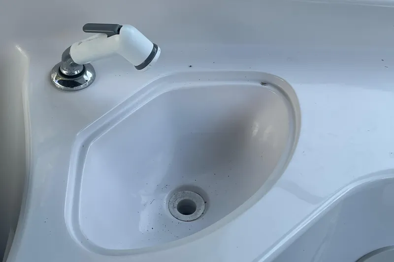 Slide: The Image of Sink and faucet on a 2000 Hurricane SunDeck 237 OB boat. - 11