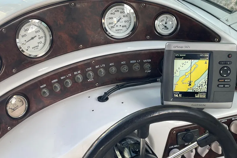 Slide: The Image of Dashboard of 2000 Hurricane SunDeck 237 OB with gauges and Garmin GPS. - 16