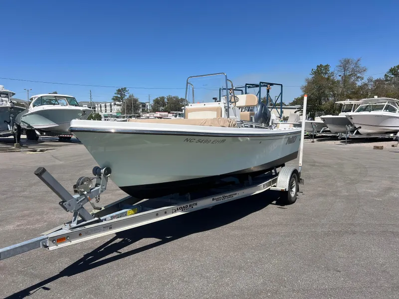 Slide: The Image of 2018 Parker 1801 Center Console boat on trailer in parking lot. - 1