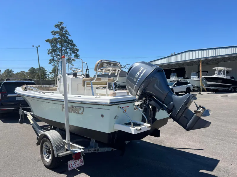 Slide: The Image of 2018 Parker 1801 Center Console boat with Yamaha outboard motor on trailer. - 2