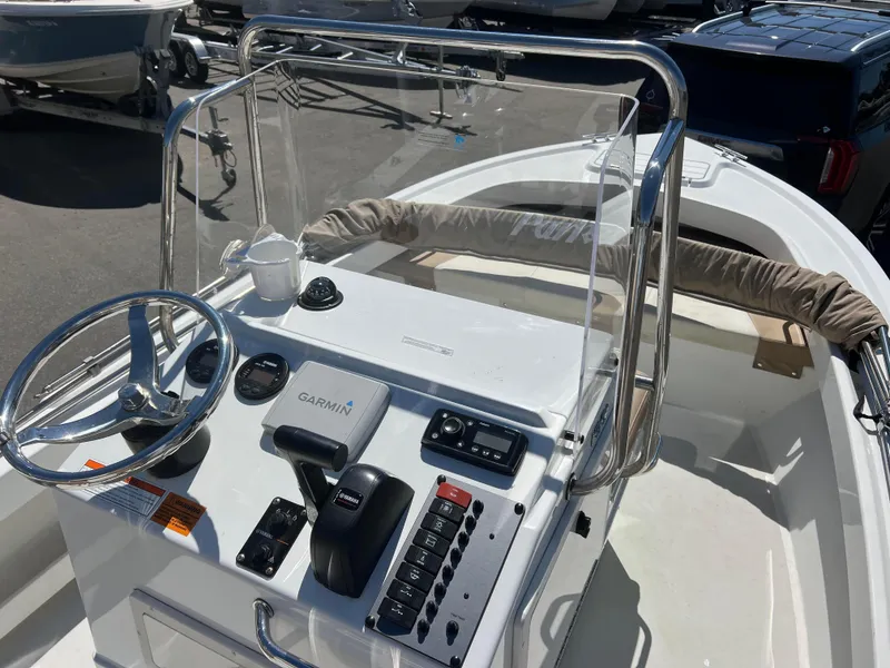 Slide: The Image of 2018 Parker 1801 Center Console boat with steering wheel and navigation controls. - 4