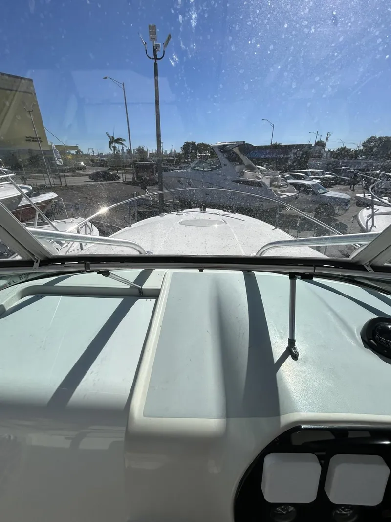 Slide: The Image of 2007 Hydra-Sports 2900 VX boat interior view with clear windshield and marina background. - 21