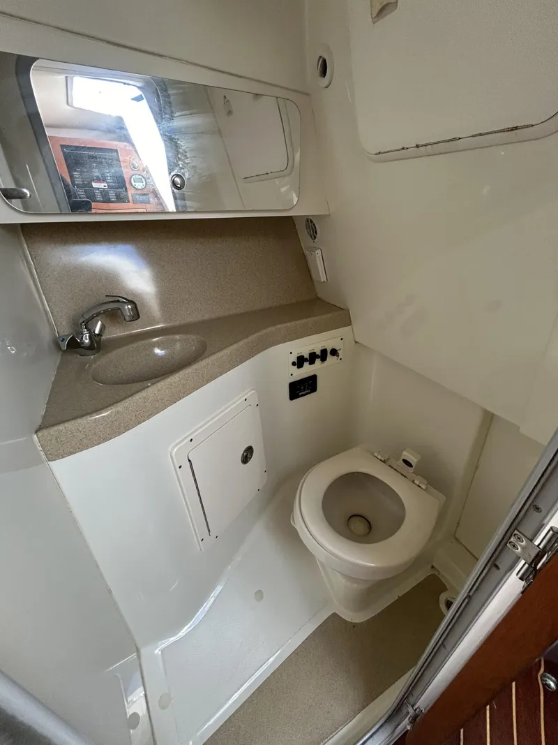 Slide: The Image of 2007 Hydra-Sports 2900 VX boat bathroom with sink, toilet, and mirror. - 28