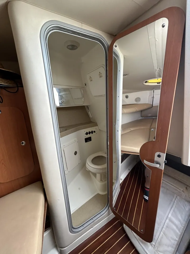 Slide: The Image of 2007 Hydra-Sports 2900 VX cabin interior with bathroom and seating area. - 29