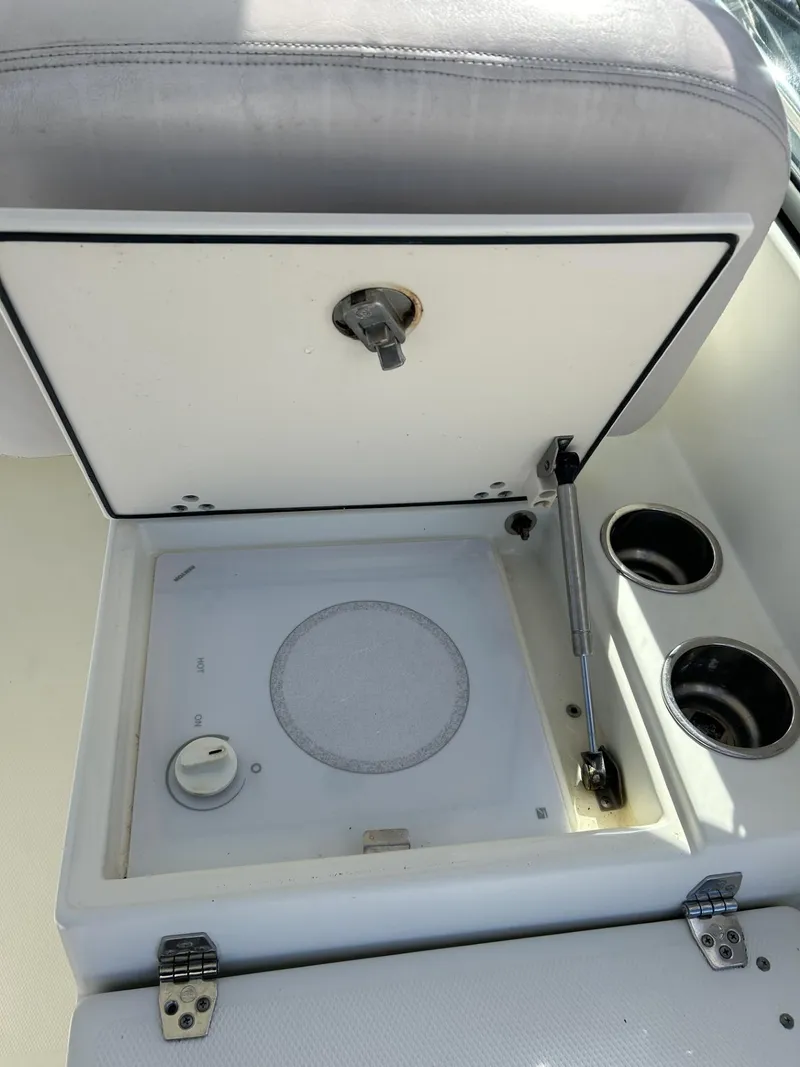 Slide: The Image of 2007 Hydra-Sports 2900 VX boat storage compartment with cup holders and latch. - 30
