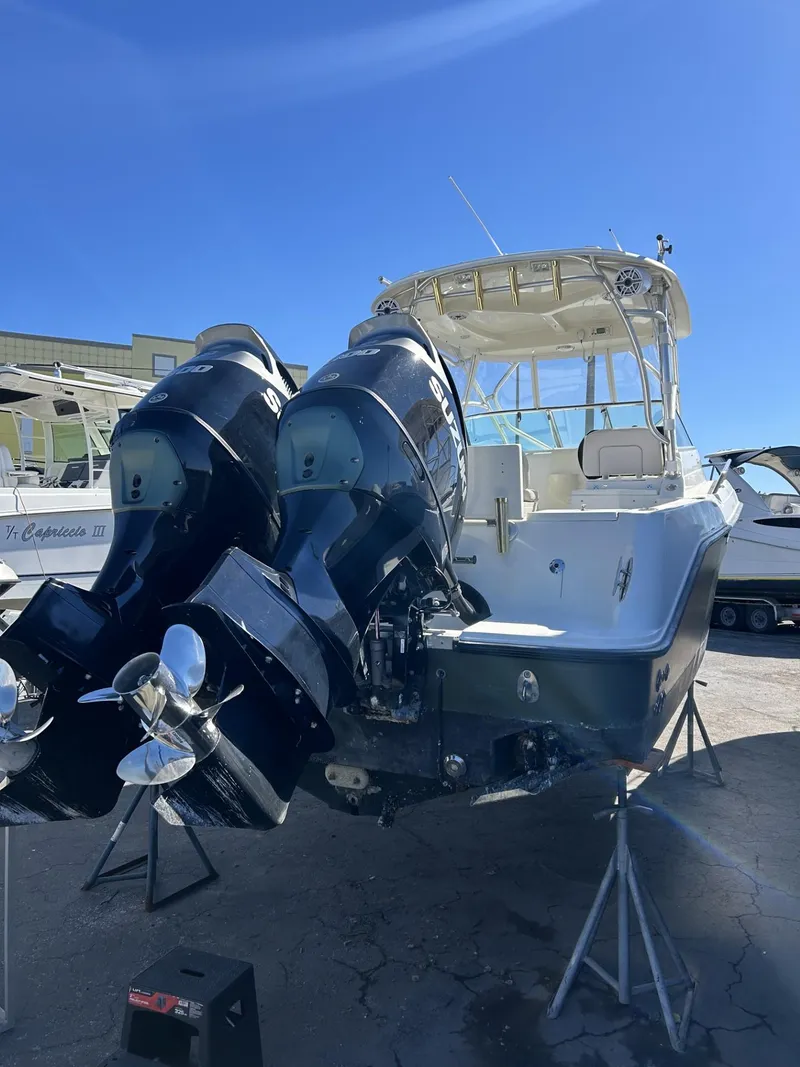 Slide: The Image of 2007 Hydra-Sports 2900 VX boat with dual outboard engines on display. - 31