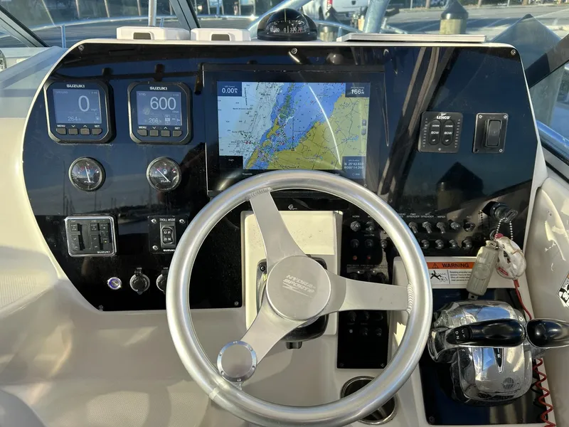 Slide: The Image of 2007 Hydra-Sports 2900 VX boat dashboard with navigation screen and controls. - 9