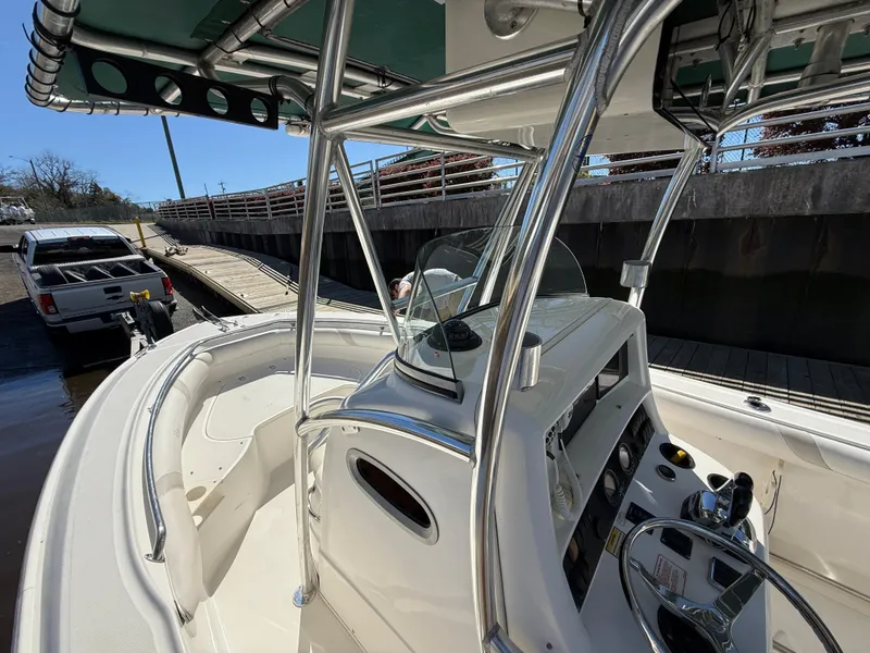 Slide: The Image of 2003 Boston Whaler 240 Outrage boat interior with console and steering wheel. - 17