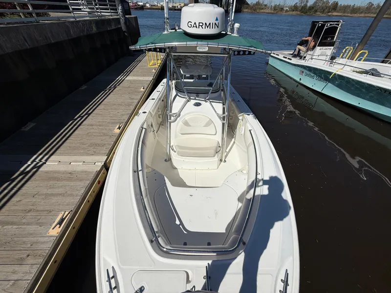 Slide: The Image of 2003 Boston Whaler 240 Outrage boat docked, featuring Garmin equipment, viewed from above. - 24