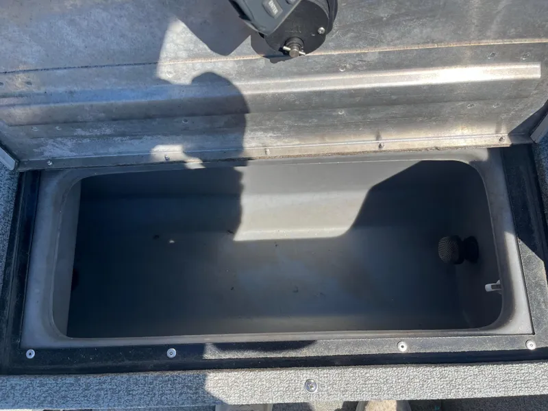 Slide: The Image of Open storage compartment in a 2018 Tracker PRO GUIDE V165 WT boat. - 12