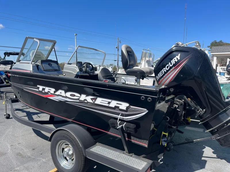 Slide: The Image of 2018 Tracker PRO GUIDE V165 WT boat with Mercury engine on trailer. - 2