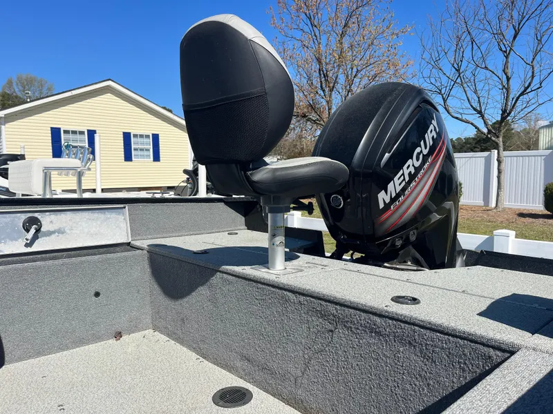Slide: The Image of 2018 Tracker PRO GUIDE V165 WT boat with Mercury engine, parked near a house. - 7