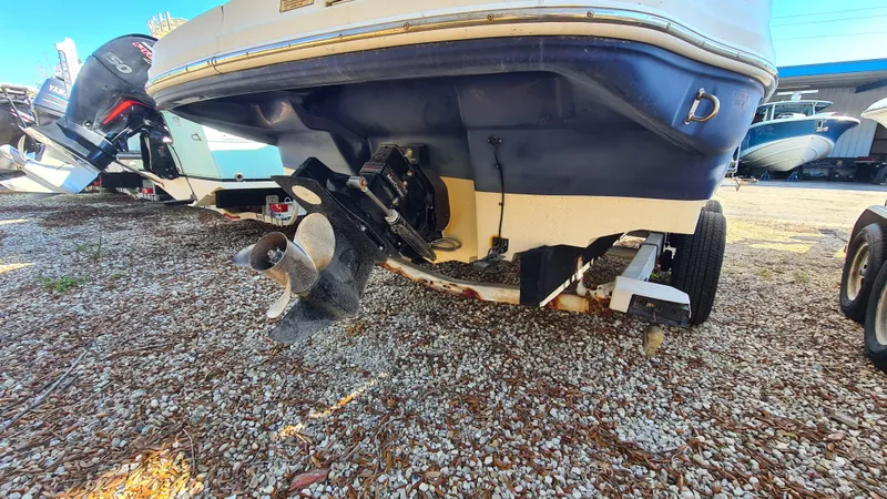 Slide: The Image of 2005 Sea Ray 200 Sundeck boat on trailer, rear view showing propeller and outdrive. - 18