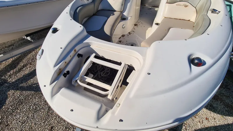 Slide: The Image of 2005 Sea Ray 200 Sundeck boat with open bow seating and storage compartment. - 3