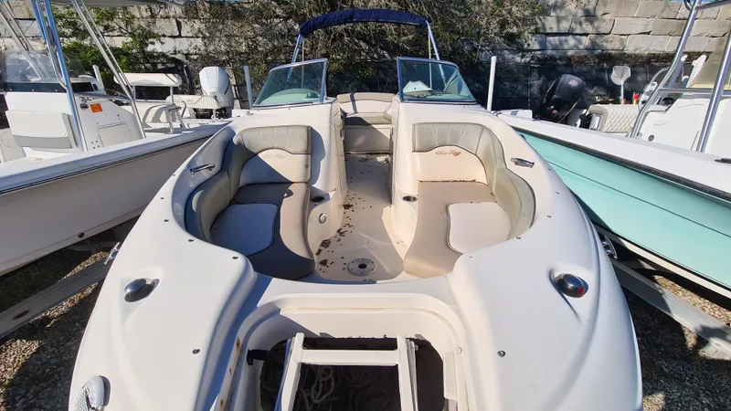 Slide: The Image of 2005 Sea Ray 200 Sundeck boat with spacious seating and open deck design. - 4