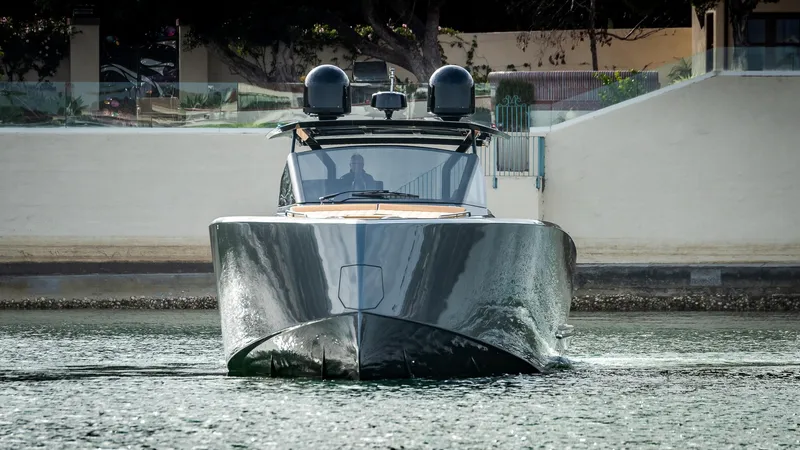 Slide: The Image of 2022 Pardo Yachts 50 luxury yacht on calm water, front view. - 11