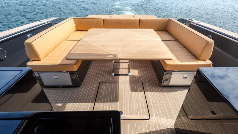 Slide: The Image of Luxurious seating area on 2022 Pardo Yachts 50, featuring elegant wood and leather design. - 16
