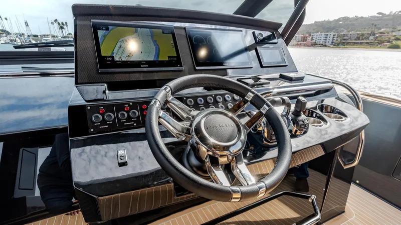 Slide: The Image of Helm of 2022 Pardo Yachts 50 with modern navigation displays and controls. - 21