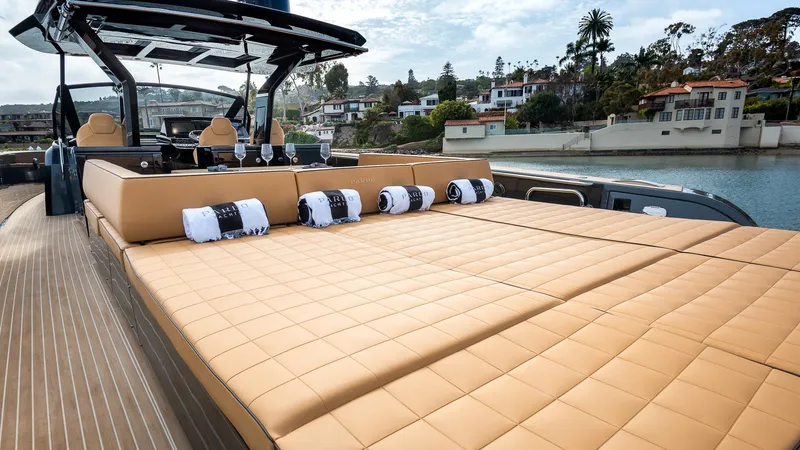 Slide: The Image of 2022 Pardo Yachts 50 with luxurious sunbathing deck and scenic waterfront view. - 29
