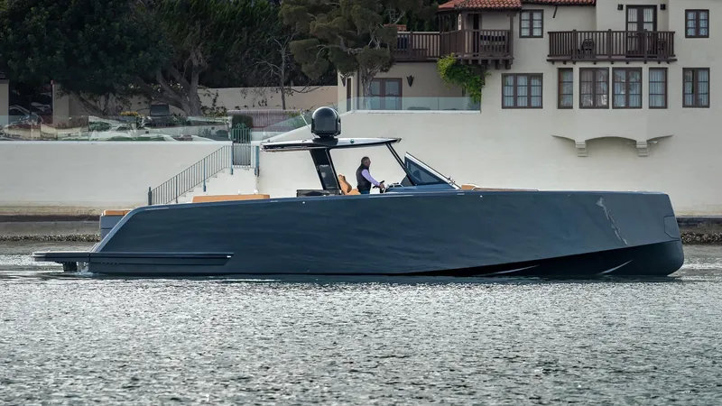 Slide: The Image of 2022 Pardo Yachts 50 cruising on water near waterfront homes. - 9