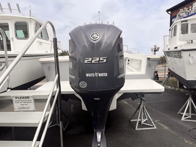 Slide: The Image of 2022 Parker 2320 SL boat with Yamaha 225 outboard engine on display. - 4