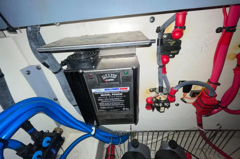 Slide: The Image of Electrical system of a 2005 Sea Ray 300 Sundancer boat, featuring wiring and components. - 11